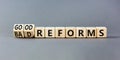 Good or bad reforms symbol. Concept words Good reforms Bad reforms on beautiful wooden blocks. Beautiful grey table grey