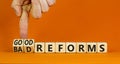 Good or bad reforms symbol. Concept words Good reforms Bad reforms on beautiful wooden blocks. Beautiful orange table orange