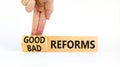 Good or bad reforms symbol. Concept words Good reforms Bad reforms on beautiful wooden blocks. Beautiful white table white