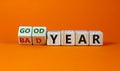 Good or bad year concept. Fliped cubes and changed the words `bad year` to `good year`. Beautiful orange background. Business Royalty Free Stock Photo