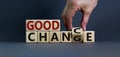 Good change - good chance. Hand flips a cube and changes the words `good change` to `good chance`. Beautiful grey background, Royalty Free Stock Photo