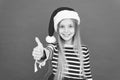 Good choice. Christmas party. Cheerful girl having fun christmas eve. Best wishes. Child santa costume believe in
