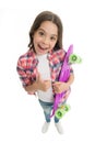 Good choice. Kid girl happy holds penny board. Child likes plastic skateboard shows thumb up. Modern teen hobby. Girl