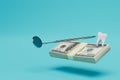 good dentist's job. a wad of dollars, a dental speculum and a tooth on a blue background. 3D render