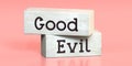 Good, evil - words on wooden blocks