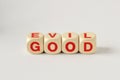 Good and Evil written with wooden cubes
