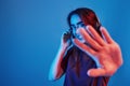 That is good feeling. Studio shot indoors with neon light. Portrait of beautiful young girl Royalty Free Stock Photo