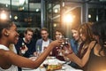 Good food, good friends, good times. friends having a dinner party at a restaurant. Royalty Free Stock Photo