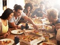 Good food with great friends. a group of friends enjoying pizza together. Royalty Free Stock Photo