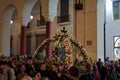 Good Friday Orthodox Easter Epitaph procession. Crowd attending the commemoration of decorated with flowers Epitafios in the