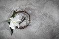 Good Friday, Passion of Jesus Christ. Crown of thorns, nails and white lily on grey background. Christian Easter holiday Royalty Free Stock Photo