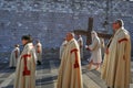 the Good Friday procession in Assisi with the penitent cross-bearer and members of the lay confraternities Royalty Free Stock Photo