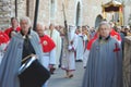 the Good Friday procession in Assisi with the penitent cross-bearer and members of the lay confraternities Royalty Free Stock Photo