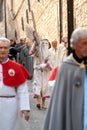 the Good Friday procession in Assisi with the penitent cross-bearer and members of the lay confraternities Royalty Free Stock Photo