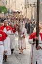 the Good Friday procession in Assisi with the penitent cross-bearer and members of the lay confraternities Royalty Free Stock Photo