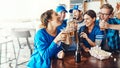 Good fun with great people. a group of friends having beers while watching a sports game at a bar. Royalty Free Stock Photo