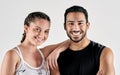 Good health keeps us glowing. Studio portrait of a sporty young man and woman posing together against a white background Royalty Free Stock Photo