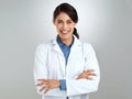 Good health makes good sense. Studio portrait of a confident young doctor posing against a grey background.