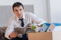 Smart young man having an idea while reading old notes Royalty Free Stock Photo