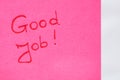 Good job handwriting text close up isolated on pink paper with copy space. Writing text on memo post reminder Royalty Free Stock Photo