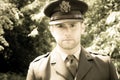 Handsome American WWII GI Army officer in uniform walking through woods