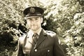 Handsome American WWII GI Army officer in uniform walking through woods