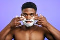 Good looking man using a shaving cream Royalty Free Stock Photo