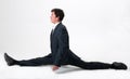 Good-looking businessman doing splits