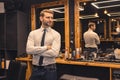 Good-looking confident businessman in a barbershop