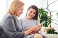 Good-looking friends surfing on Internet in laptop