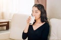 Beautiful young woman with glass of milk at home Royalty Free Stock Photo