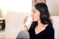 Beautiful young woman with glass of milk at home Royalty Free Stock Photo