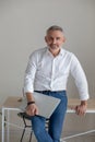 Good-looking gray-haired man working on laptop Royalty Free Stock Photo