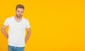 Good looking guy unshaven face. Hipster with bristle wear white t-shirt. Handsome man posing. Charismatic macho Royalty Free Stock Photo