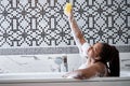 Good-looking happy african female clean fresh healthy black skin spa treatment enjoy relaxing taking shower and bath Royalty Free Stock Photo