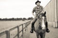 Handsome cowboy, horse rider on saddle, horseback adn boots Royalty Free Stock Photo