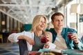 Good-looking lovely couple sit talking with friends in front of them Royalty Free Stock Photo