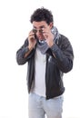 Good looking man in a leather jacket talking over phone Royalty Free Stock Photo