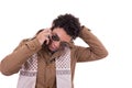 good looking man with sunglasses wearing jacket and scarf talking on mobile phone Royalty Free Stock Photo