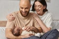 good looking modern parents hugging and Royalty Free Stock Photo