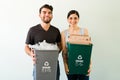 Happy woman and man recycling some materials Royalty Free Stock Photo