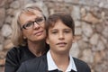 Good-looking, single-parent mom and teen son in the park. Photo Royalty Free Stock Photo