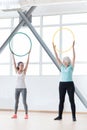 Good looking sporty women holding hula hoops Royalty Free Stock Photo