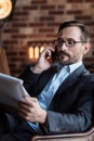 Good looking stylish businessman having a phone conversation Royalty Free Stock Photo