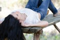 Good looking woman lie on a wooden table Royalty Free Stock Photo