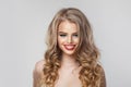 Good-looking woman with make-up, fresh skin, perfect white toothy smile and long healthy shiny blonde wavy hair, fashion beauty Royalty Free Stock Photo