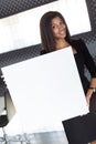 Good looking young business lady in black strong suite hold empty paper Royalty Free Stock Photo