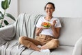 Good looking young woman eating vegetable salad Royalty Free Stock Photo