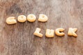 Good luck alphabet biscuit on wooden table