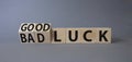 Good Luck and bad Luck symbol. Turned wooden cubes with words Bad Luck and Good Luck. Beautiful grey background. Business concept Royalty Free Stock Photo